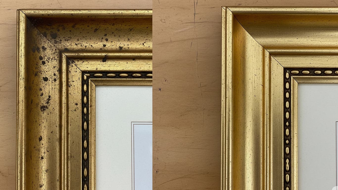 Gold surface undergoing laser cleaning showing precise contamination removal