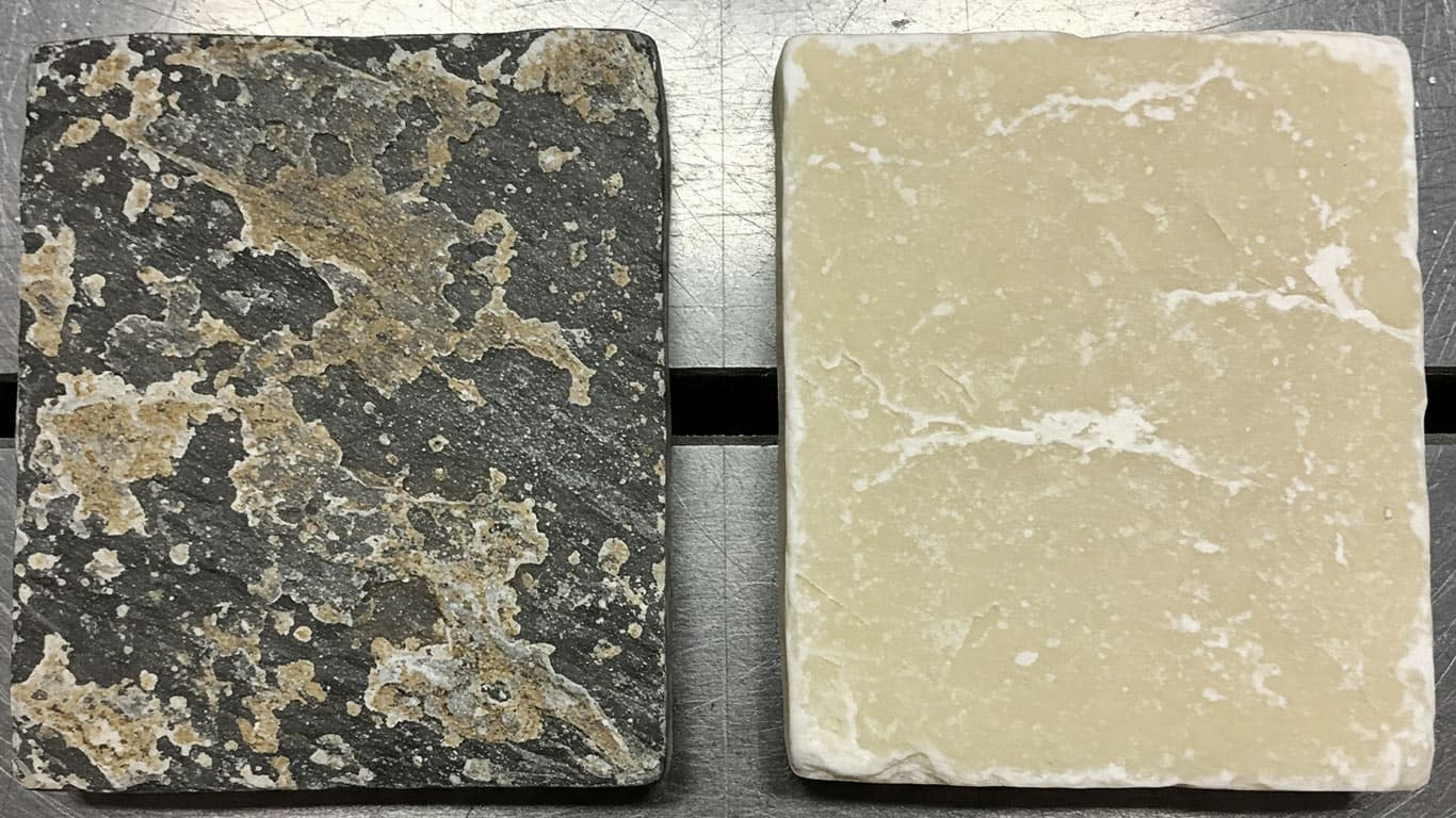 Soapstone surface undergoing laser cleaning showing precise contamination removal