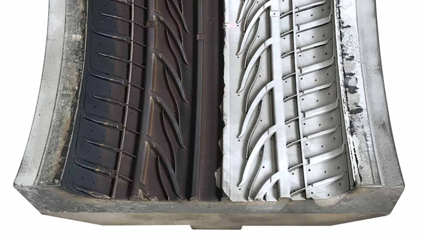 Tungsten surface undergoing laser cleaning showing precise contamination removal