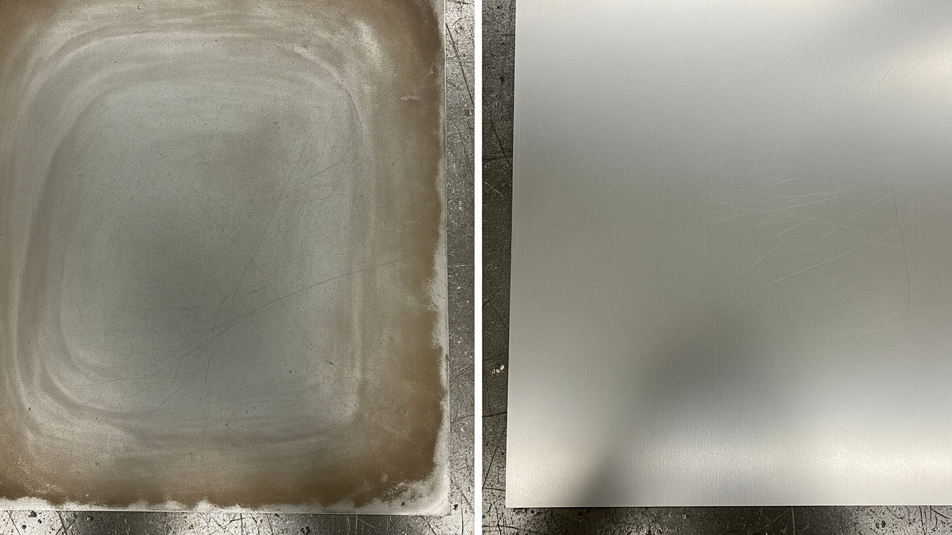 Niobium surface undergoing laser cleaning showing precise contamination removal