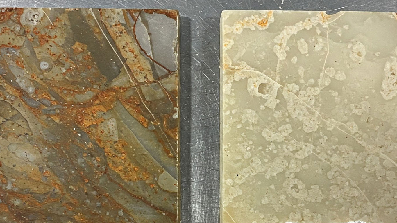 Onyx surface undergoing laser cleaning showing precise contamination removal