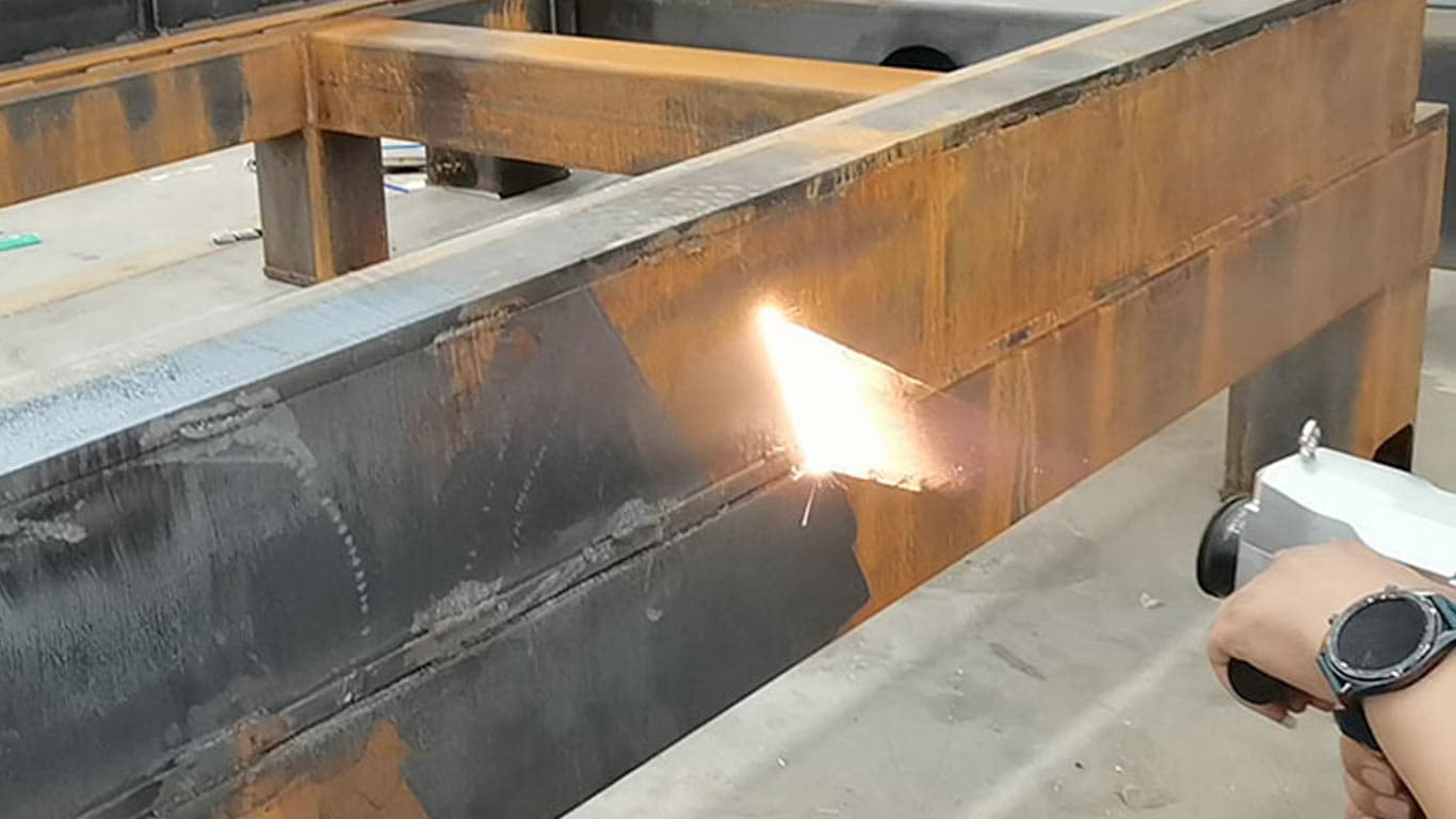 Laser cleaning metal fabrication weld surfaces and structural components
