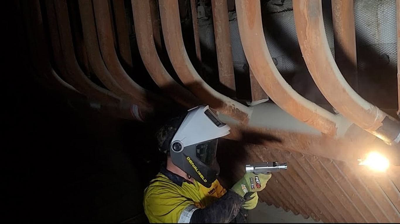 Online laser cleaning of power plant boiler tubes and heat exchangers without shutdown