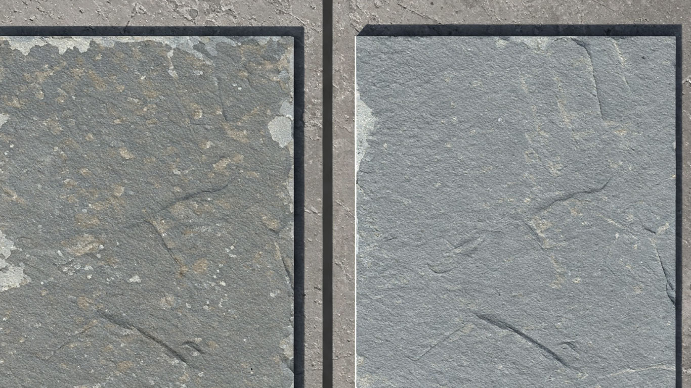 Bluestone surface undergoing laser cleaning showing precise contamination removal