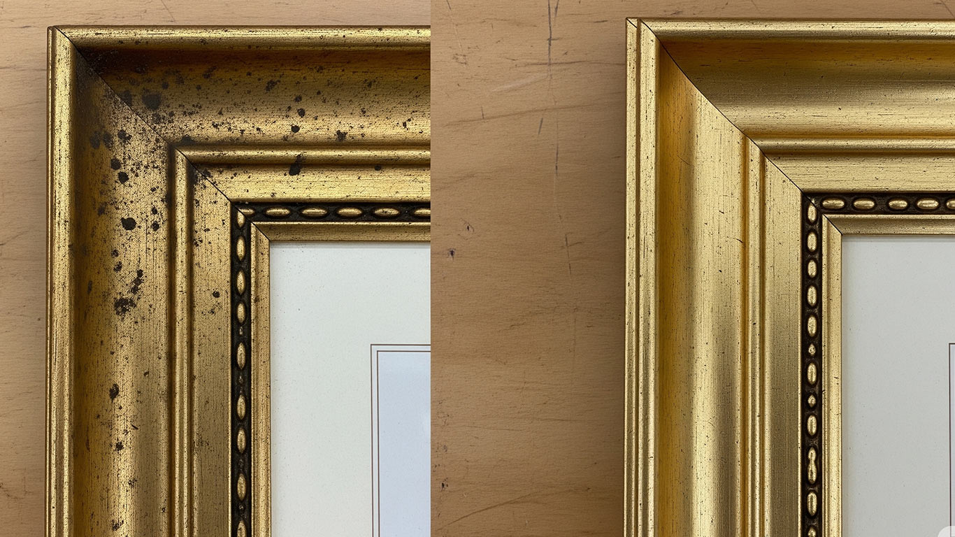 Gold surface undergoing laser cleaning showing precise contamination removal