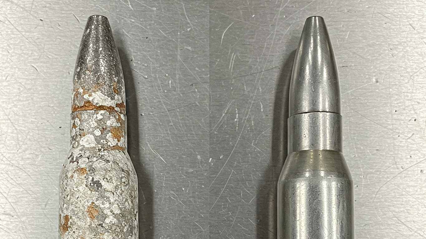 Lead surface undergoing laser cleaning showing precise contamination removal