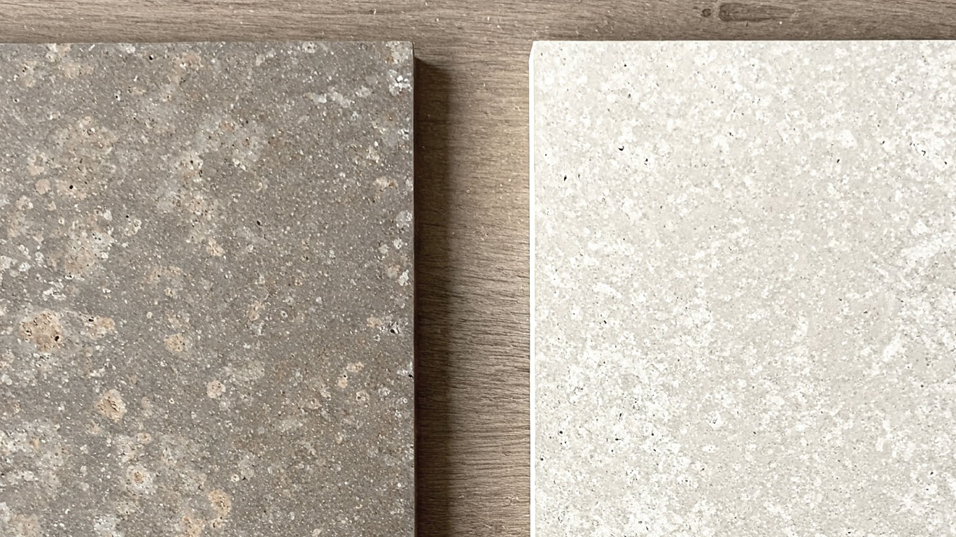 Porphyry surface undergoing laser cleaning showing precise contamination removal