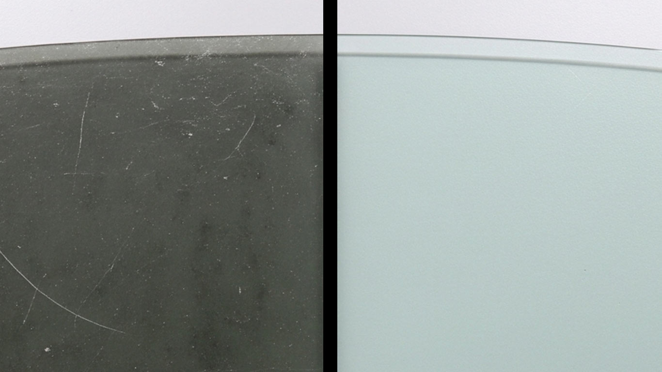 Tempered Glass surface undergoing laser cleaning showing precise contamination removal